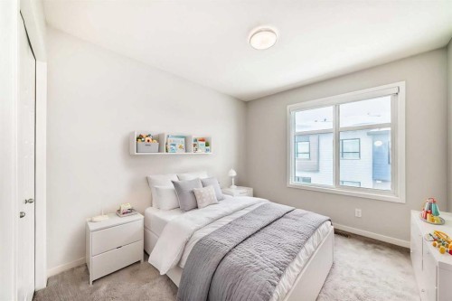 136-42 Cranbrook Gardens Se, Calgary, AB - Indoor Photo Showing Bedroom