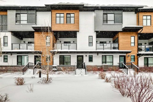 136-42 Cranbrook Gardens Se, Calgary, AB - Outdoor With Balcony With Facade