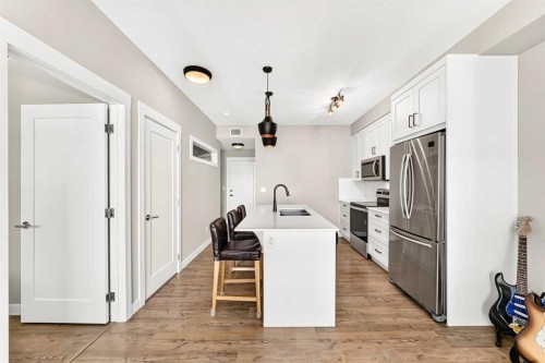 402-300 Auburn Meadows Common Se, Calgary, AB - Indoor Photo Showing Kitchen With Stainless Steel Kitchen
