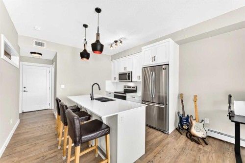 402-300 Auburn Meadows Common Se, Calgary, AB - Indoor Photo Showing Kitchen With Stainless Steel Kitchen With Double Sink With Upgraded Kitchen