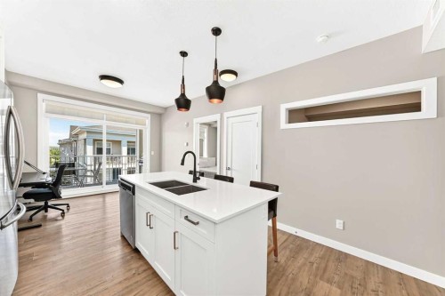 402-300 Auburn Meadows Common Se, Calgary, AB - Indoor Photo Showing Kitchen With Double Sink