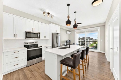 402-300 Auburn Meadows Common Se, Calgary, AB - Indoor Photo Showing Kitchen With Stainless Steel Kitchen With Double Sink With Upgraded Kitchen