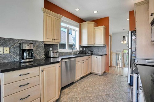 6 Discovery Woods Villas Sw, Calgary, AB - Indoor Photo Showing Kitchen With Stainless Steel Kitchen