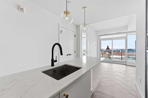 606-8445 Broadcast Avenue Sw, Calgary, AB - Indoor Photo Showing Kitchen