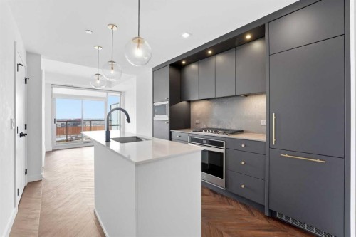606-8445 Broadcast Avenue Sw, Calgary, AB - Indoor Photo Showing Kitchen With Upgraded Kitchen