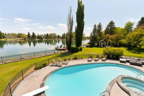 120 Lake Placid Green Se, Calgary, AB - Outdoor With Body Of Water With In Ground Pool With Backyard