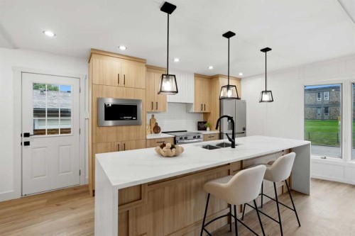 908 Stonehaven Road Sw, Calgary, AB - Indoor Photo Showing Kitchen With Double Sink With Upgraded Kitchen