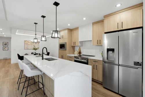 908 Stonehaven Road Sw, Calgary, AB - Indoor Photo Showing Kitchen With Double Sink With Upgraded Kitchen