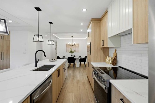 908 Stonehaven Road Sw, Calgary, AB - Indoor Photo Showing Kitchen With Double Sink With Upgraded Kitchen