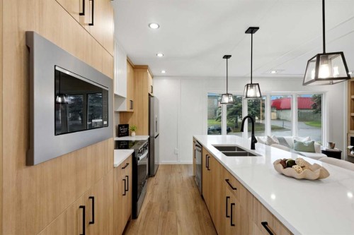 908 Stonehaven Road Sw, Calgary, AB - Indoor Photo Showing Kitchen With Double Sink With Upgraded Kitchen