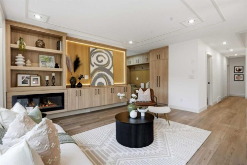 908 Stonehaven Road Sw, Calgary, AB - Indoor Photo Showing Other Room With Fireplace