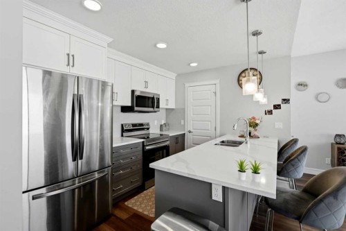 610-10060 46 Street Ne, Calgary, AB - Indoor Photo Showing Kitchen With Stainless Steel Kitchen With Double Sink With Upgraded Kitchen