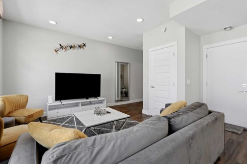 610-10060 46 Street Ne, Calgary, AB - Indoor Photo Showing Living Room