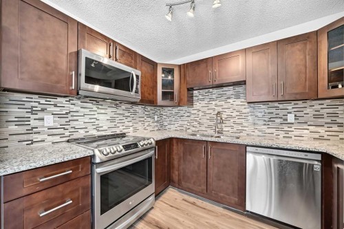 91 Cedarwood Hill Sw, Calgary, AB - Indoor Photo Showing Kitchen With Stainless Steel Kitchen With Upgraded Kitchen