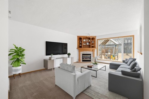 41 Bow Ridge Drive, Cochrane, AB - Indoor Photo Showing Living Room With Fireplace