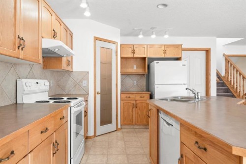 41 Bow Ridge Drive, Cochrane, AB - Indoor Photo Showing Kitchen With Double Sink