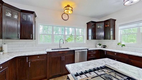 24-33049 Range Road 12, Rural Mountain View County, AB - Indoor Photo Showing Kitchen With Upgraded Kitchen