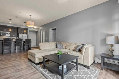114-6703 New Brighton Avenue Se, Calgary, AB - Indoor Photo Showing Living Room