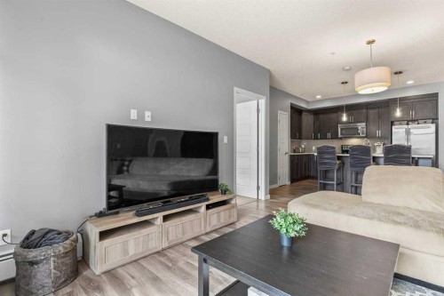 114-6703 New Brighton Avenue Se, Calgary, AB - Indoor Photo Showing Living Room