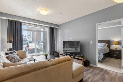 114-6703 New Brighton Avenue Se, Calgary, AB - Indoor Photo Showing Living Room