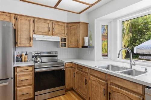 331 Queensland Circle Se, Calgary, AB - Indoor Photo Showing Kitchen With Stainless Steel Kitchen With Double Sink