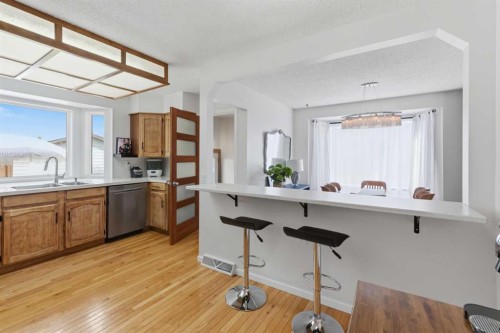 331 Queensland Circle Se, Calgary, AB - Indoor Photo Showing Kitchen With Double Sink