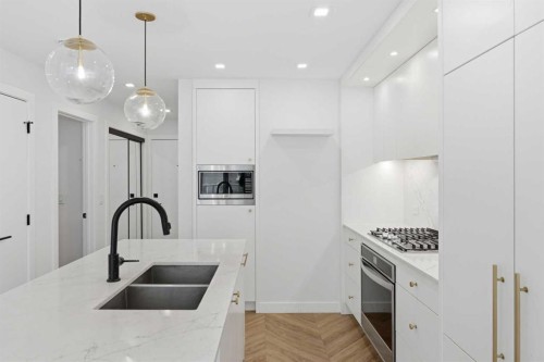 307-8445 Broadcast Avenue Sw, Calgary, AB - Indoor Photo Showing Kitchen With Double Sink With Upgraded Kitchen
