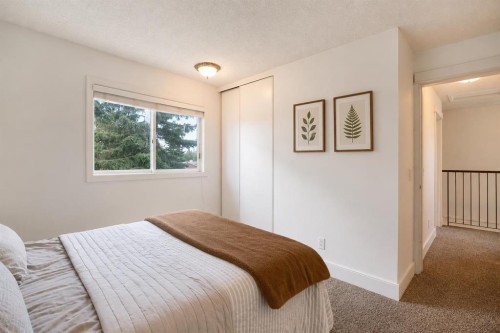 56 Deersaxon Circle Se, Calgary, AB - Indoor Photo Showing Bedroom