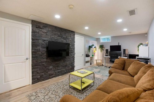 56 Deersaxon Circle Se, Calgary, AB - Indoor Photo Showing Living Room With Fireplace