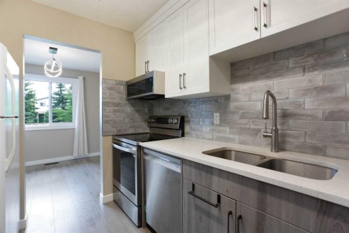 3627 Cedarille Drive Sw, Calgary, AB - Indoor Photo Showing Kitchen With Double Sink With Upgraded Kitchen
