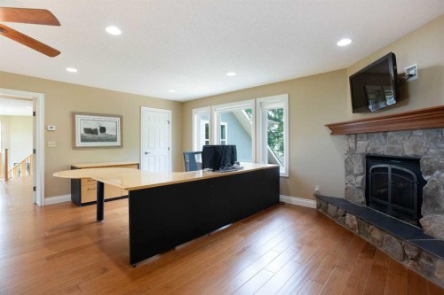 57-39408 Range Road 21, Rural Lacombe County, AB - Indoor Photo Showing Living Room With Fireplace