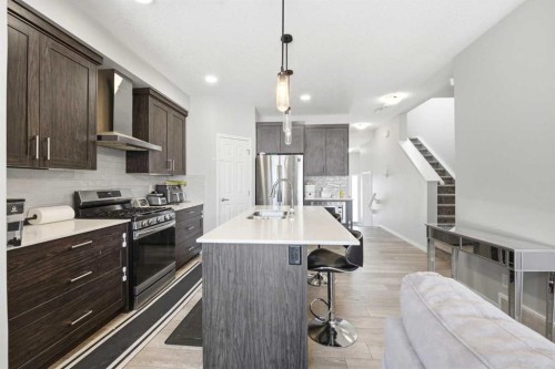 121 Carringvue Park Nw, Calgary, AB - Indoor Photo Showing Kitchen With Double Sink With Upgraded Kitchen