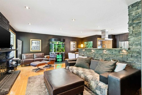 10220 Brookpark Boulevard Sw, Calgary, AB - Indoor Photo Showing Living Room With Fireplace