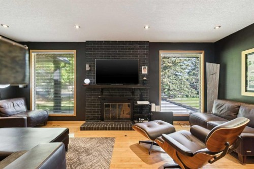 10220 Brookpark Boulevard Sw, Calgary, AB - Indoor Photo Showing Living Room With Fireplace