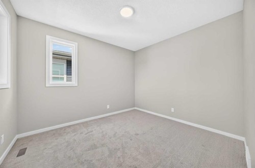 48 Creekside Path Sw, Calgary, AB - Indoor Photo Showing Other Room