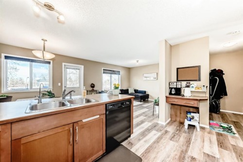 602-800 Yankee Valley Boulevard Se, Airdrie, AB - Indoor Photo Showing Kitchen With Double Sink