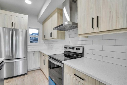 106-116 Saddlestone Heath Ne, Calgary, AB - Indoor Photo Showing Kitchen With Stainless Steel Kitchen With Upgraded Kitchen