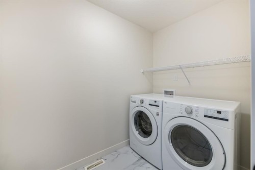 250 Alpine Avenue Sw, Calgary, AB - Indoor Photo Showing Laundry Room