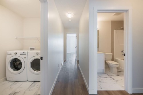 250 Alpine Avenue Sw, Calgary, AB - Indoor Photo Showing Laundry Room
