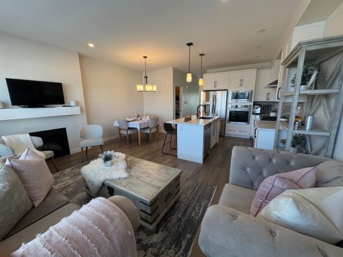 250 Alpine Avenue Sw, Calgary, AB - Indoor Photo Showing Living Room With Fireplace