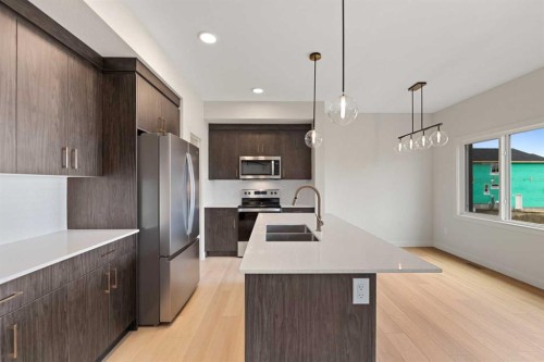 38 Waterford Mews, Chestermere, AB - Indoor Photo Showing Kitchen With Double Sink With Upgraded Kitchen