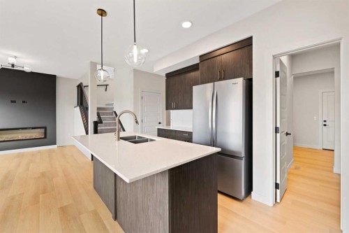 38 Waterford Mews, Chestermere, AB - Indoor Photo Showing Kitchen With Double Sink