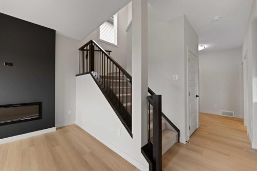 38 Waterford Mews, Chestermere, AB - Indoor With Fireplace