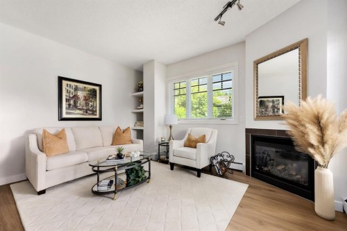 106-108 25 Avenue Sw, Calgary, AB - Indoor Photo Showing Living Room With Fireplace