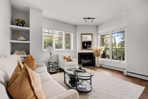 106-108 25 Avenue Sw, Calgary, AB - Indoor Photo Showing Living Room With Fireplace