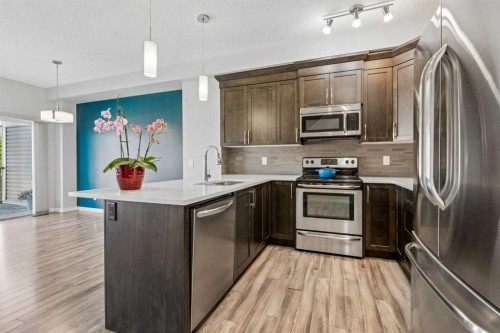 549 Hillcrest Road Sw, Airdrie, AB - Indoor Photo Showing Kitchen With Stainless Steel Kitchen With Upgraded Kitchen