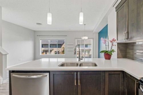 549 Hillcrest Road Sw, Airdrie, AB - Indoor Photo Showing Kitchen With Double Sink