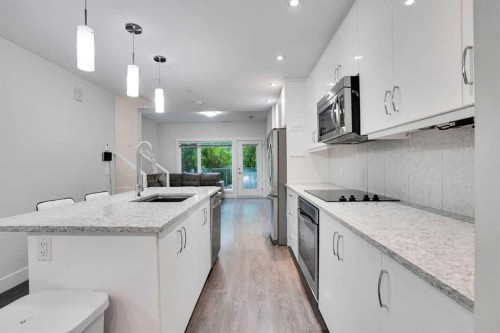 207-20 Brentwood Common Nw, Calgary, AB - Indoor Photo Showing Kitchen With Upgraded Kitchen