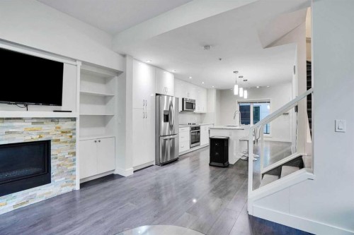 207-20 Brentwood Common Nw, Calgary, AB - Indoor With Fireplace