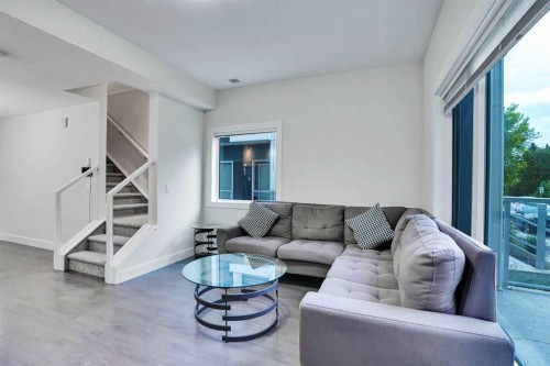 207-20 Brentwood Common Nw, Calgary, AB - Indoor Photo Showing Living Room